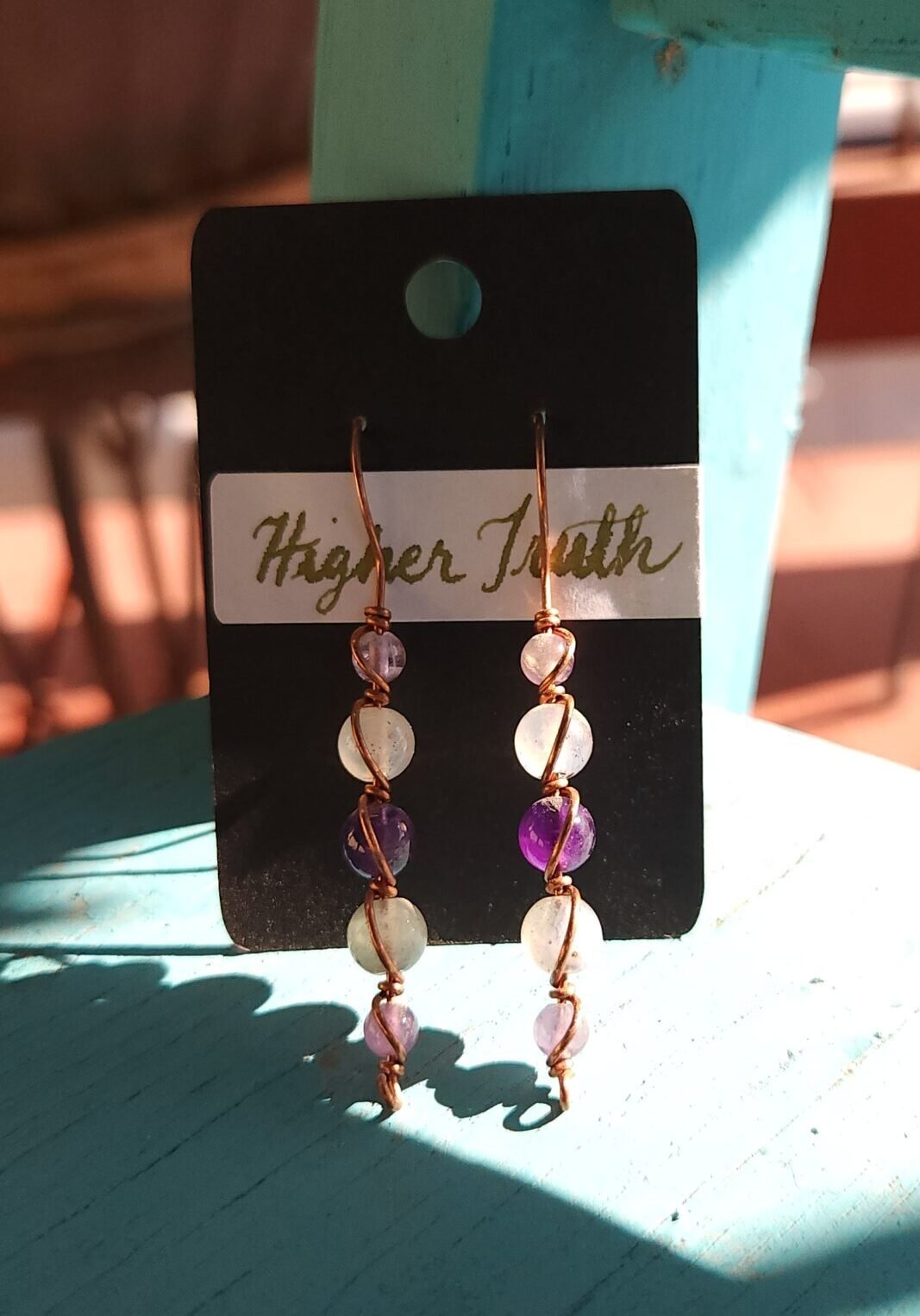 Copper wire wrapped earrings with amethyst and labradorite beads.
